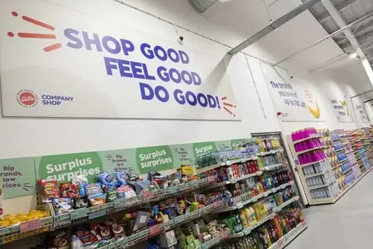 Company Shop slogan above shelves