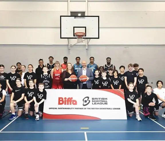 Centred (with basketballs) - Maxine Mayhew (Biffa), Aaron Radin (League) with London Lions academy players & staff, and League players. (Credit: British Basketball League)