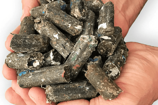 Man holding waste pellets in newly acquired Hull pellet plant