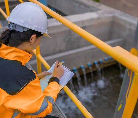 Female in high vis with clipboard