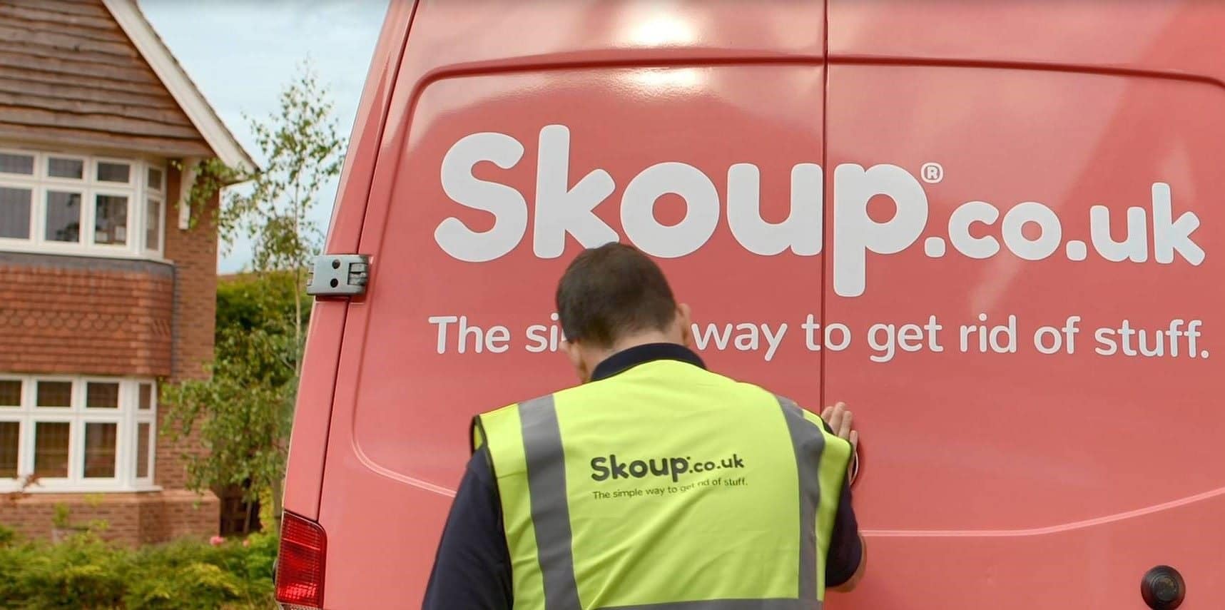 Worker in front of Skoup van doors