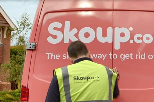 Worker in front of Skoup van doors