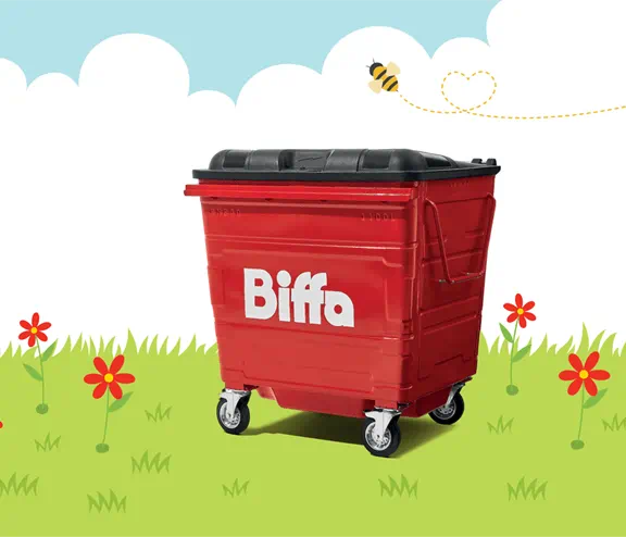 Biffa bin in grass with red flowers