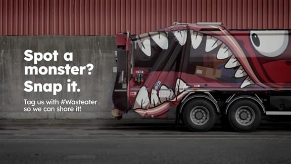Waste truck with waste eating monster on it