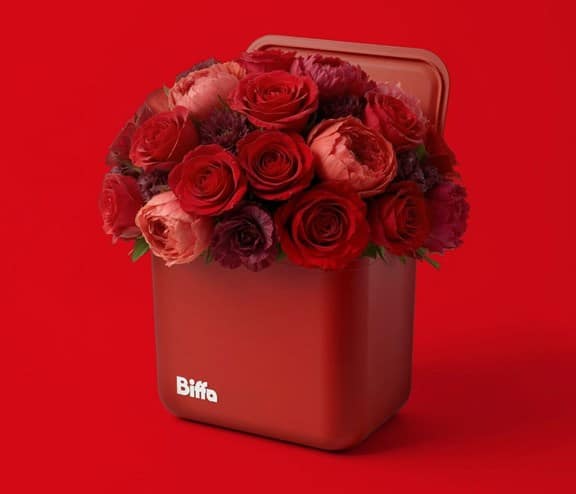 Red food caddy with roses in it