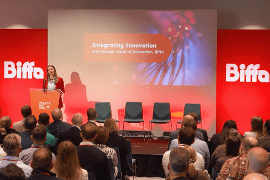 Amy on stage presenting at WNZ