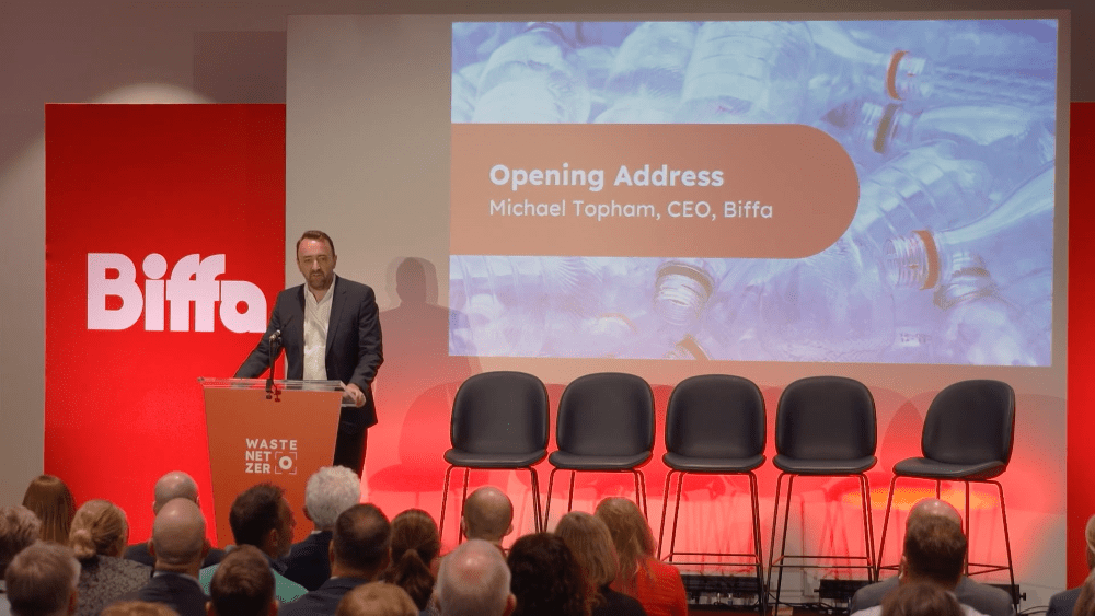 Michael standing on stage opening