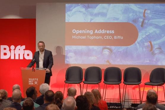 Michael standing on stage opening