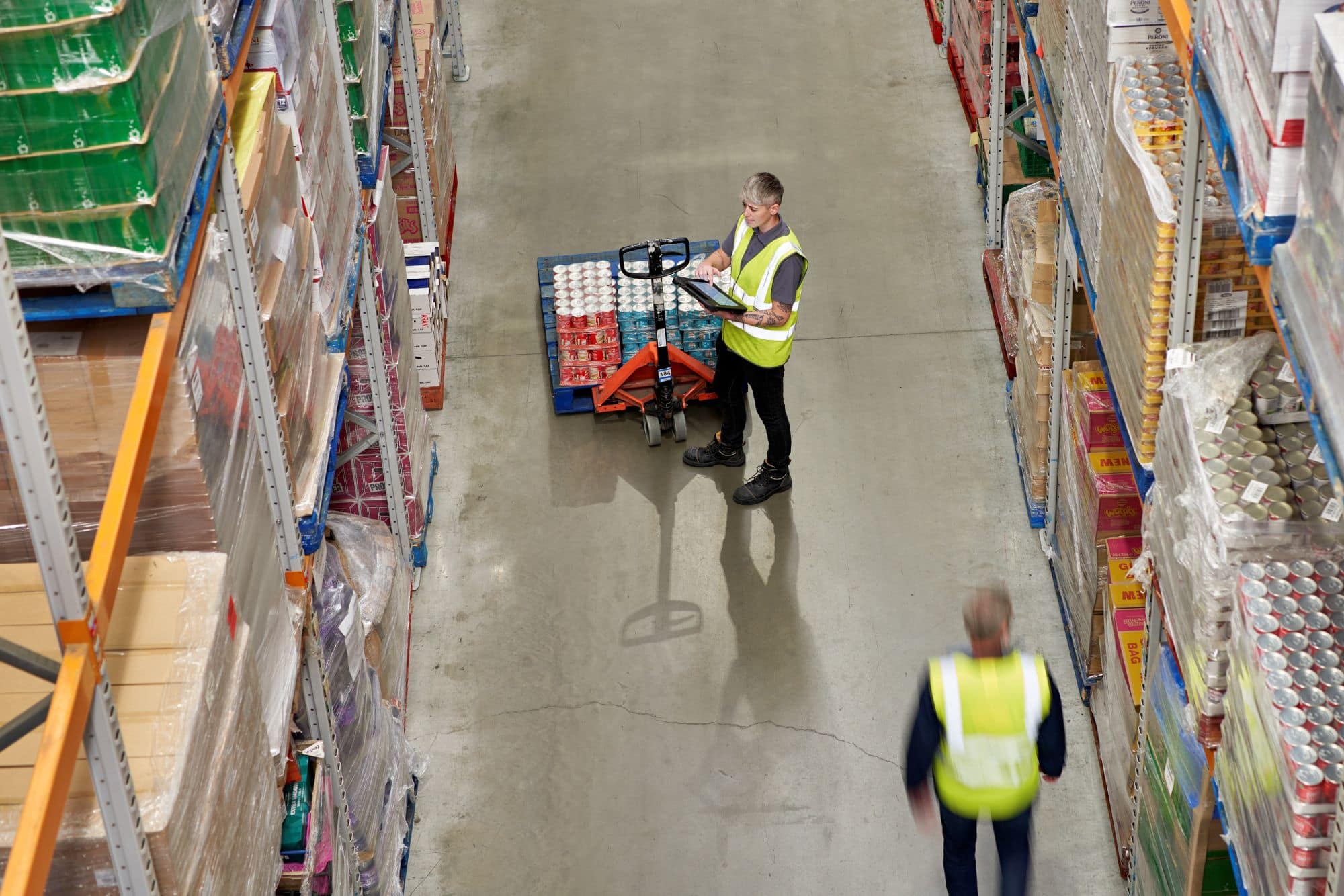 Employees documenting products in warehouse