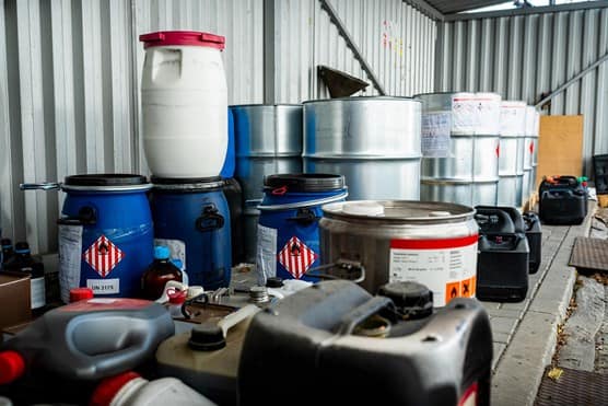 Metal and plastic barrels containing hazardous chemicals