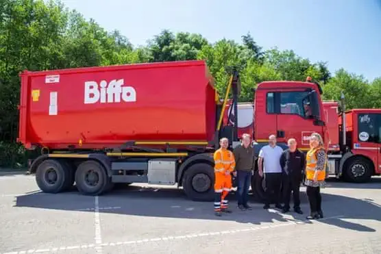 Biffa and NEC staff in front of Biffa vehicle