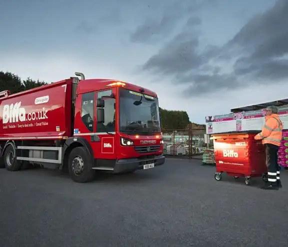 Biffa vehicle and worker outside courtyard