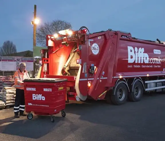 Biffa worker with bin and truck