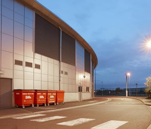 Biffa large bins lined up outside building