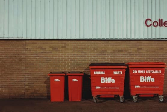 Bins lined up in front of wall