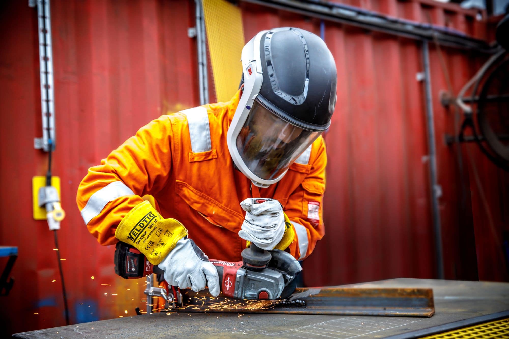 Employee working on metal at materials recovery facility