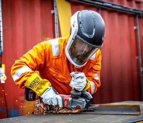 Employee working on metal at materials recovery facility
