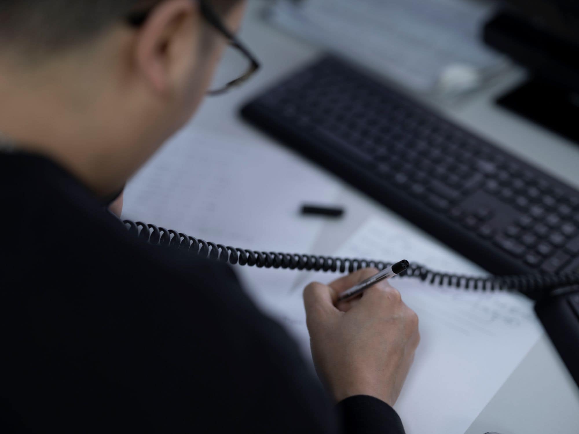 Employee writing paperwork