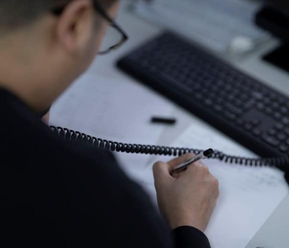 Employee writing paperwork