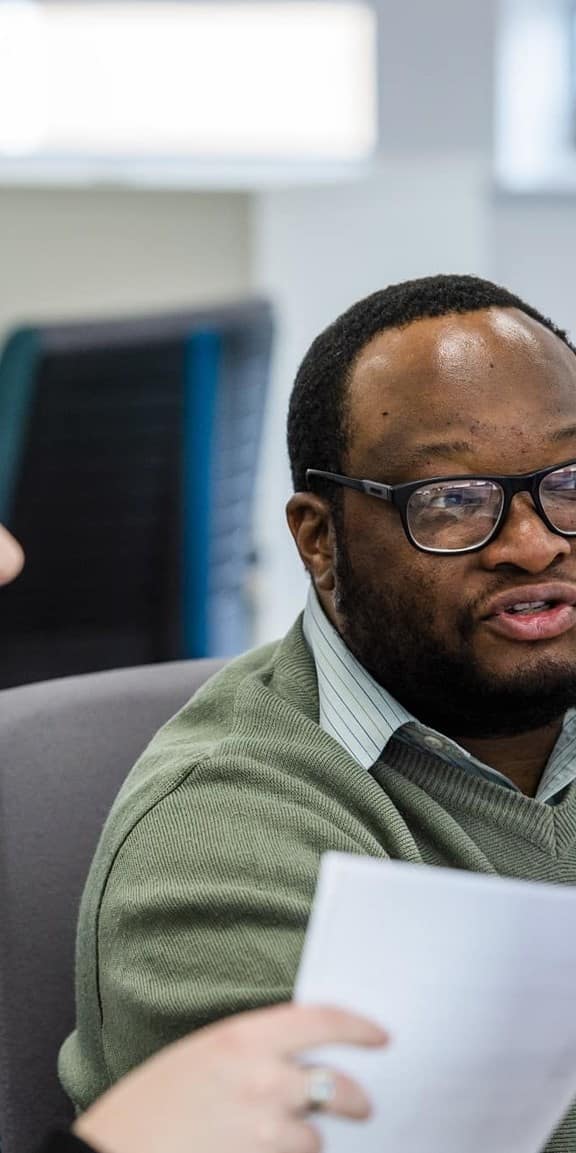 Female and male co worker looking at monitor