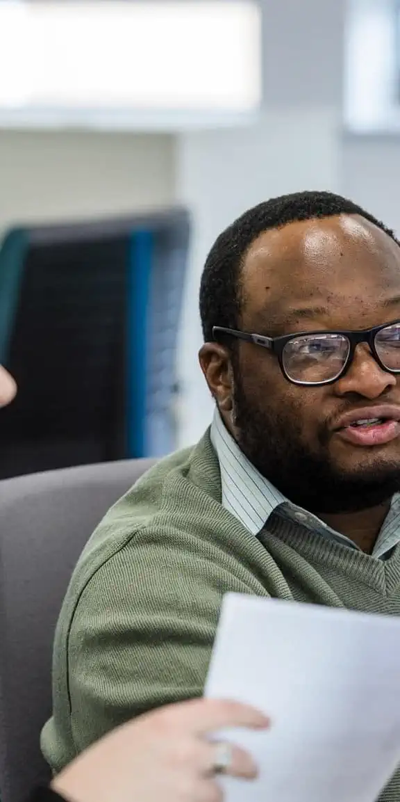 Female and male co worker looking at monitor