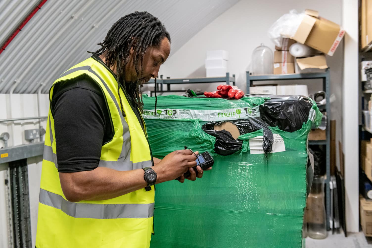 Man in high vis with PDA