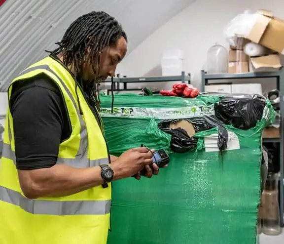 Man in high vis with PDA