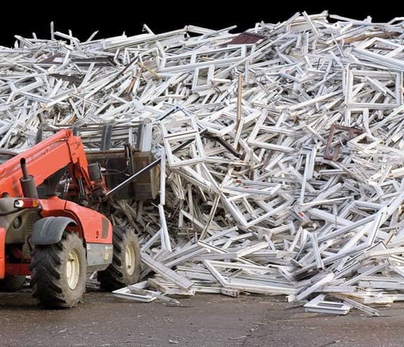 uPVC window frames moved by red loader truck