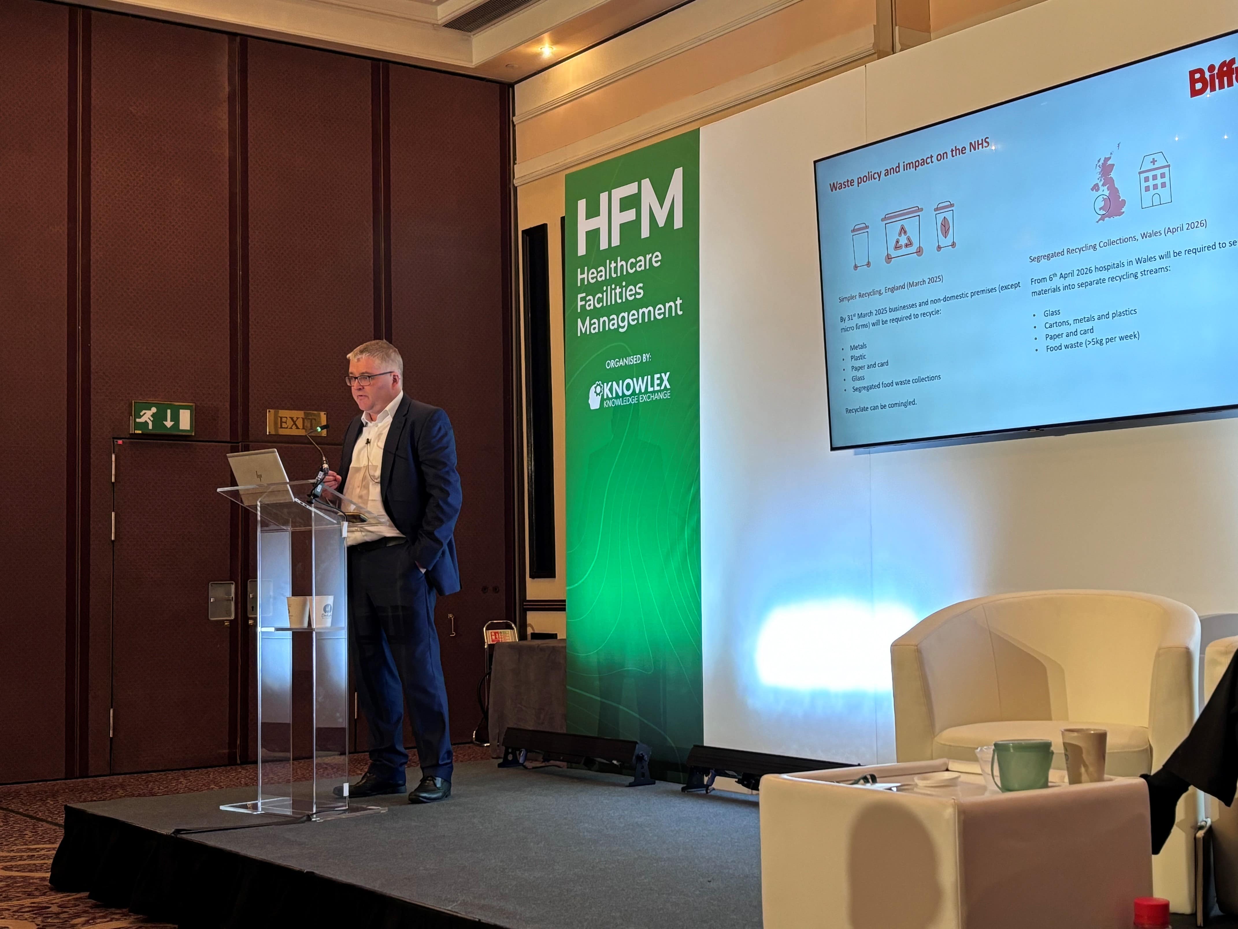 Simon speaking to a crowd on a stage at HFM 2024