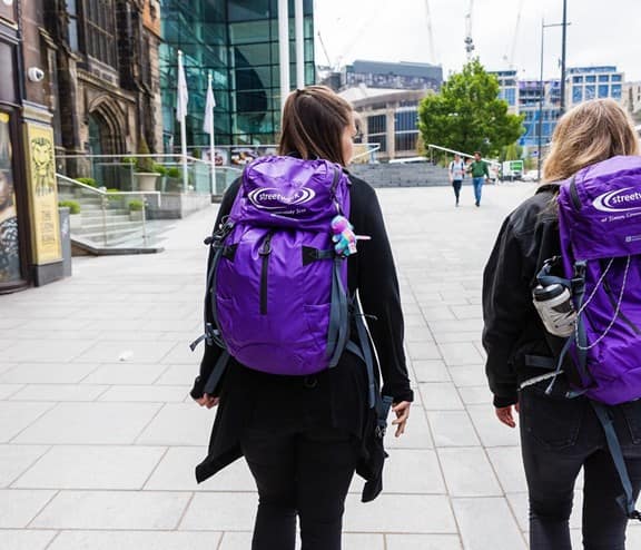2 girls with backpacks