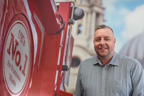 Biffa employee standing next to Biffa waste truck in Welham Green