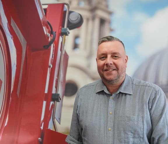 Biffa employee standing next to Biffa waste truck in Welham Green