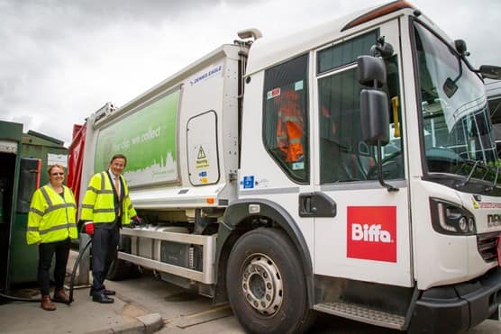 Biffa's top level management standing next to new truck that has recently converted from diesel to HVO