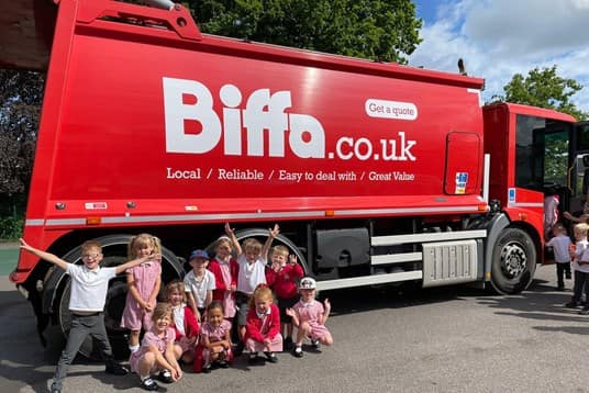School children in front of Biffa vehicle in Guilford