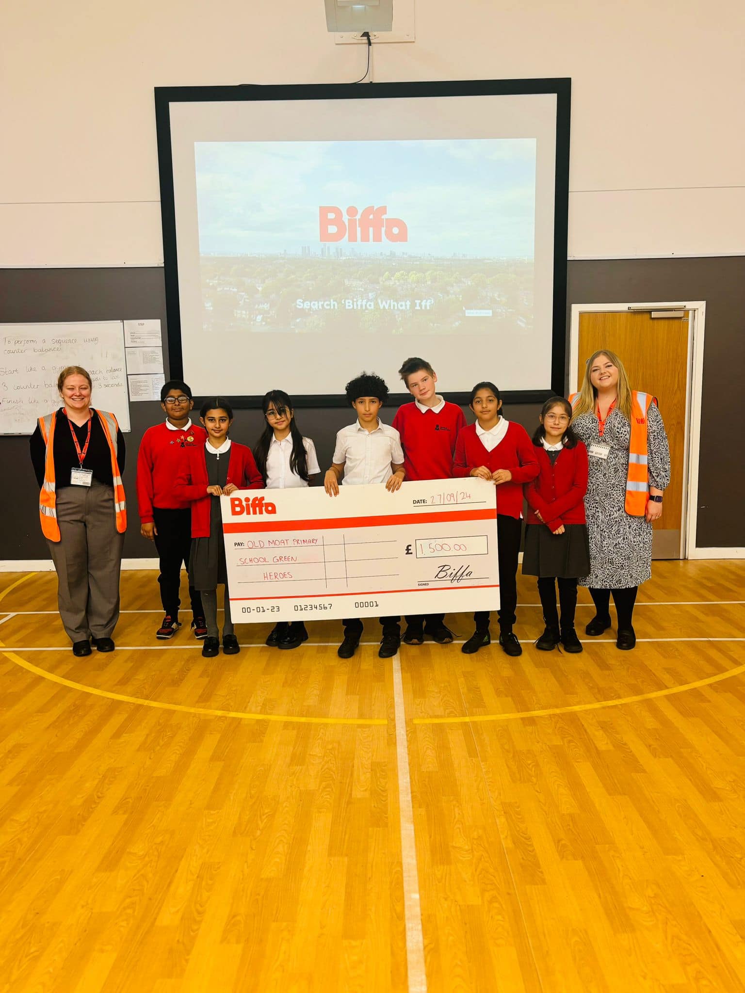 Biffa surprising old moat primary school with a cheque 
