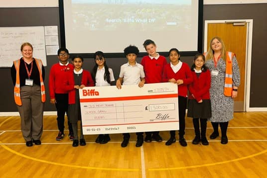 Biffa surprising old moat primary school with a cheque