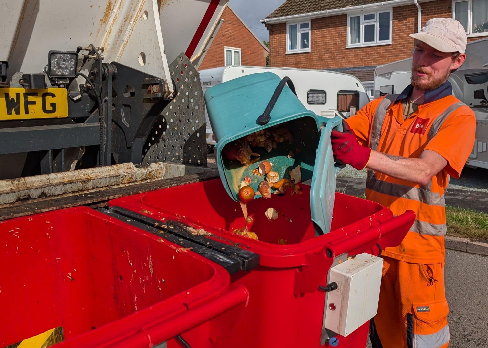 Caddy being emptied into truck