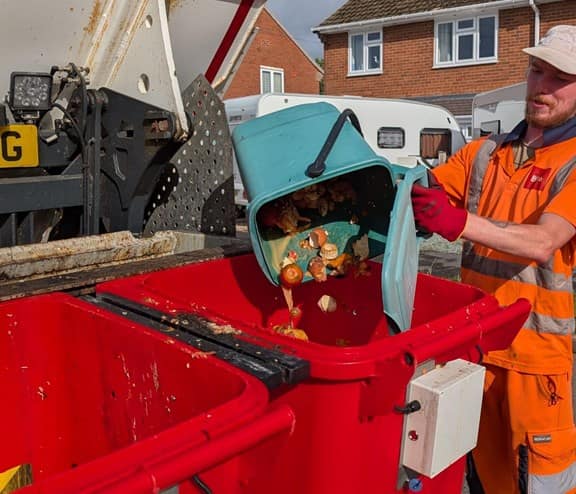 Caddy being emptied into truck