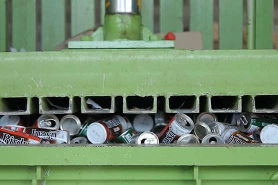 Machine squashing loads of cans
