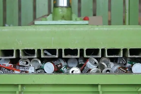 Machine squashing loads of cans