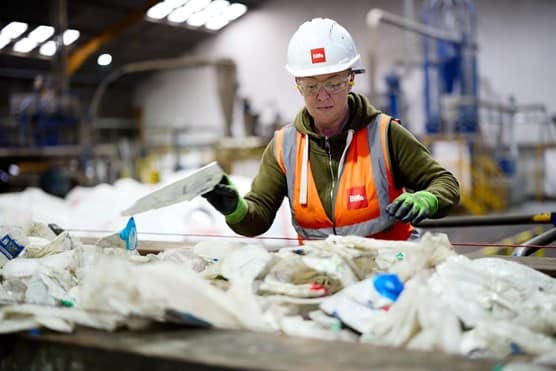 Female employee sorting waste