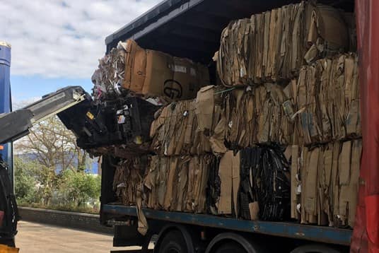 baled cardboard in truck