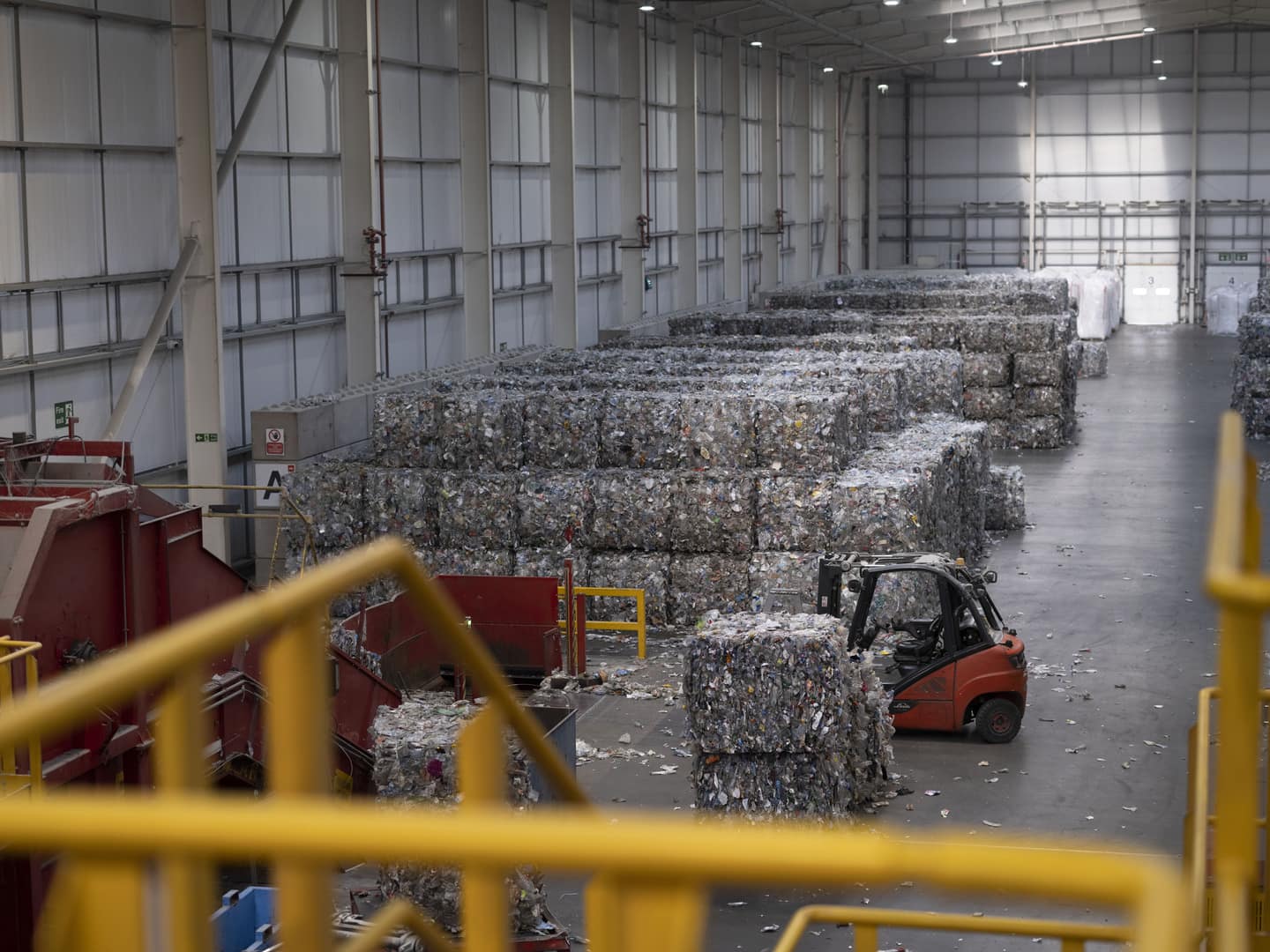 Forklift picking up waste 