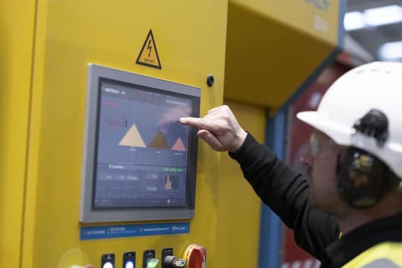 Biffa employee operating the screen in waste transfer station