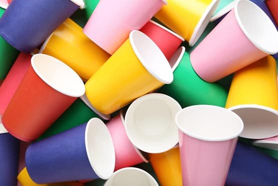 A pile of colourful single use cups