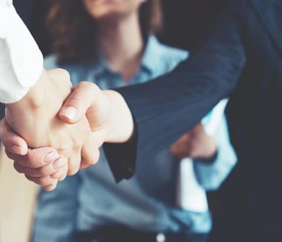 business people shaking hands in the office