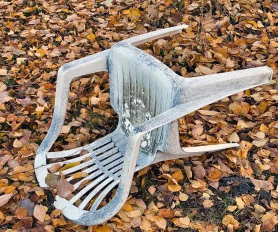Plastic chair on leaves